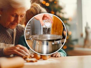 Persona che versa sale nell'acqua della pasta