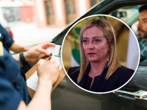 Giorgia Meloni e vigile che fa una multa