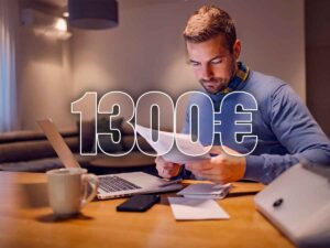 persona che guarda documenti e simbolo 1300 euro