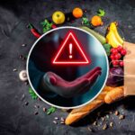 Segnale d'allarme e busta della spesa con cibo