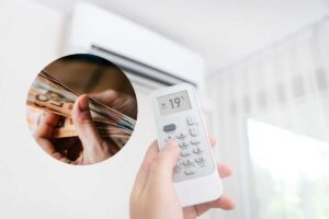 aziona condizionatore con telecomando e soldi nel cerchietto