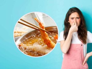 frittura di pesce con vicino una ragazza che si tura il naso
